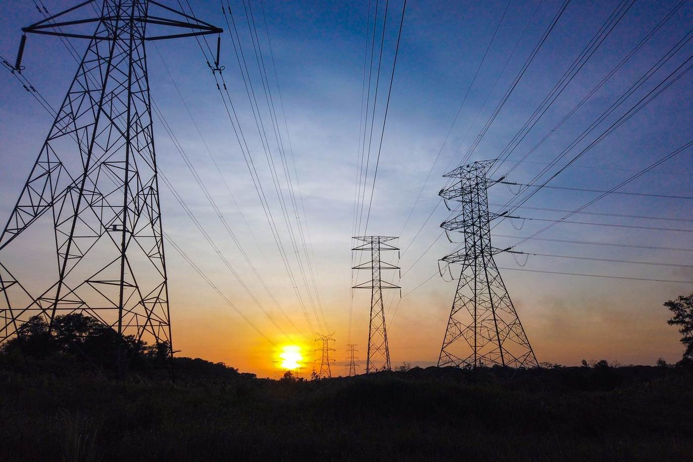 Power lines and towers at sunset